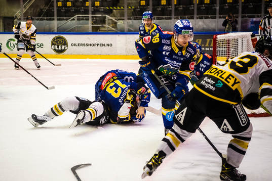 Sondre Bjerke of Storhamar and Brady Maurice Brassart of