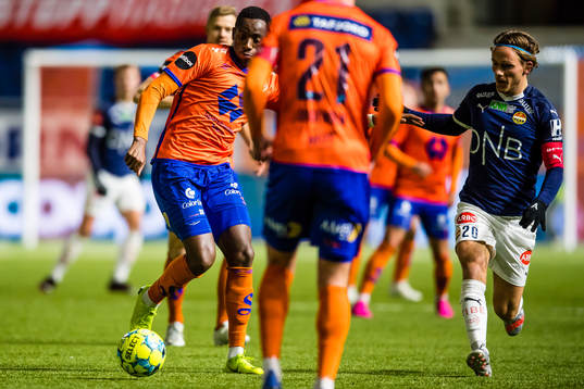 Parfait Bizoza of Aalesund and Mikkel Maigaard Jakobsen of