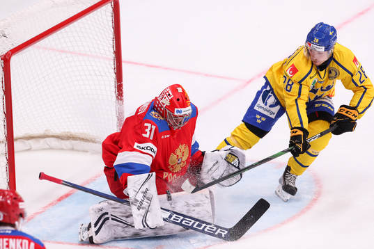 Goalkeeper Alexander Samonov of Russia and Jesper Frödén