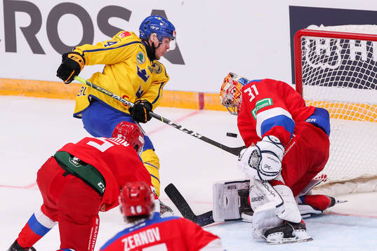 Andreas Wingerli of Sweden against goalkeeper Alexander