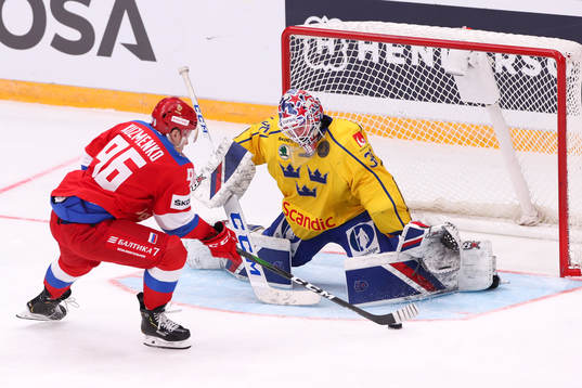 Andrei Kuzmenko of Russia against goalkeeper Magnus