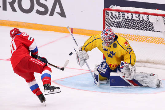 Nikita Soshnikov of Russia against goalkeeper Magnus