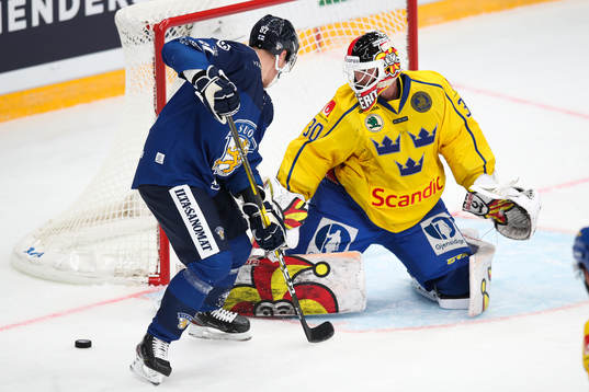Harri Pesonen of Finland and goalkeeper Anders