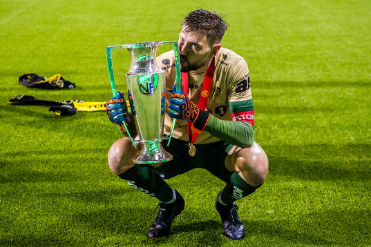 Nikita Haikin of Bodø/Glimt celebrates with the trophy