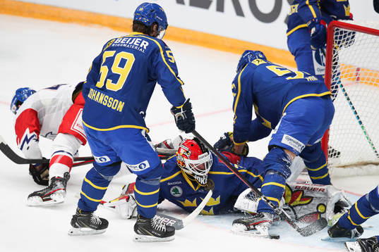 Linus Johansson of Sweden goalkeeper Anders Lindbäck ,
