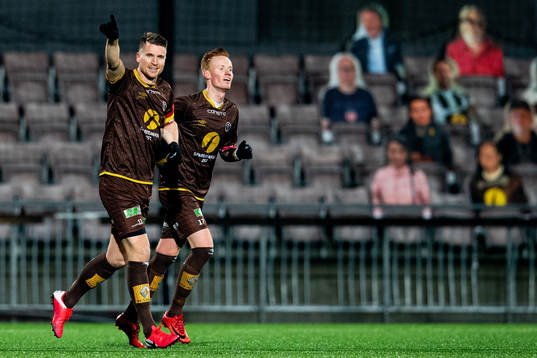 Christian Gauseth of Mjøndalen celebrates with teammate