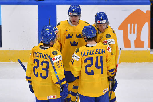 Team Sweden teammates discuss the play