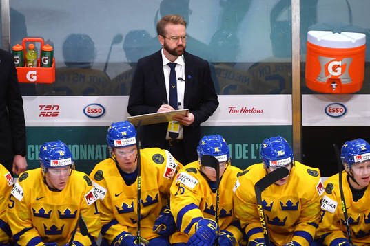 Sweden Team Manager Linus Hugosson watches the play
