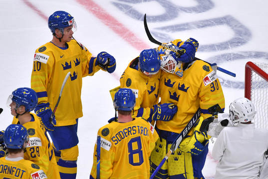 Team Sweden celebrates their 7-1 victory