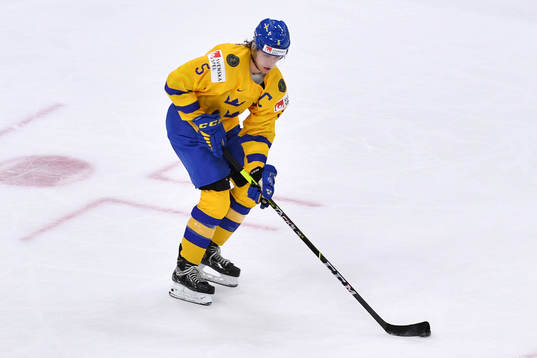 Philip Broberg of Sweden carries the puck
