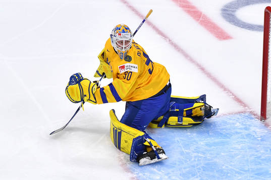 Hugo Alnefelt of Sweden watches the puck go wide of the goal