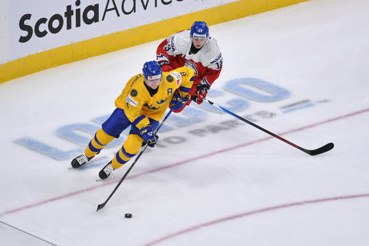 Victor Söderström skates with the puck