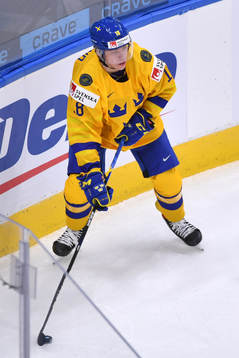 Lucas Raymond of Team Sweden looks to make a pass