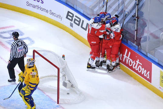 Jan Mysak celebrates a first period goal with teammates