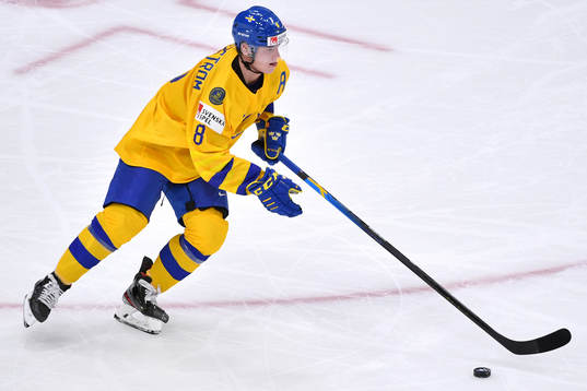 Victor Söderström of Sweden skates with the puck