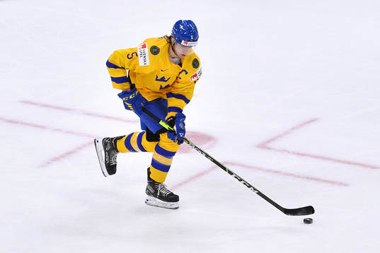 Philip Broberg of Sweden carries the puck