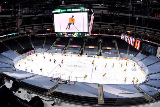Team Austria and Team Sweden warm up prior to the 2021 IIHF