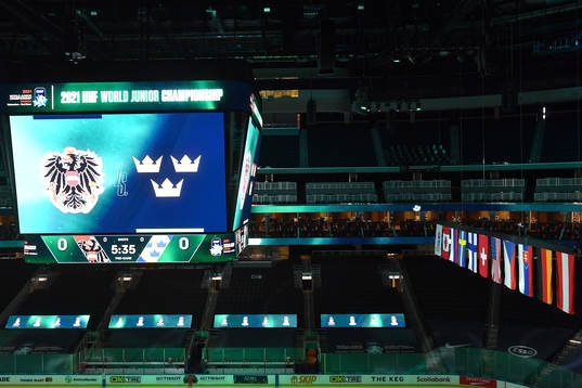 The score clock at Rogers Place displays Austria and Sweden