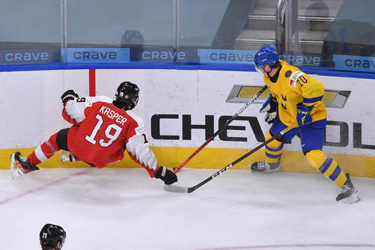 Alexander Holtz of Sweden and Marco Kasper of Austia collide