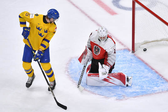 Elmer Söderblom of Sweden watches the puck enter the net