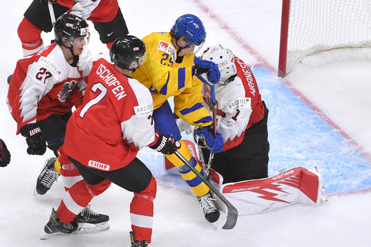 Elmer Söderblom of Sweden crashes the net