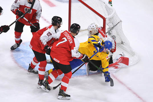 Elmer Söderblom of Sweden crashes the net