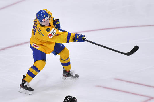 Victor Söderström of Sweden clears the puck from his own