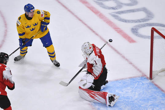 Sebastien Wraneshitz of Austria makes a save with Alexander
