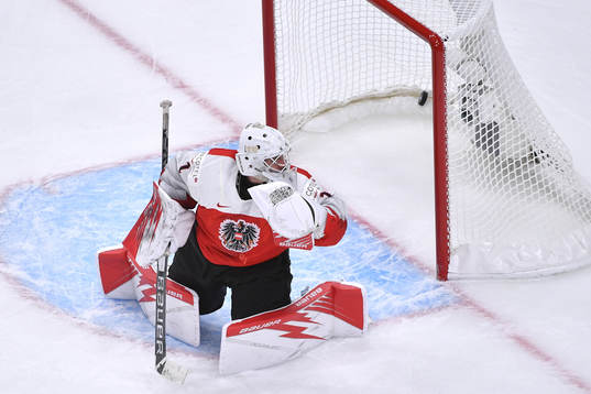 Sebastien Wraneshitz of Austria watches the puck enter the