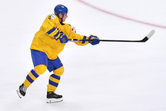Emil Andrae of Sweden shoots the puck