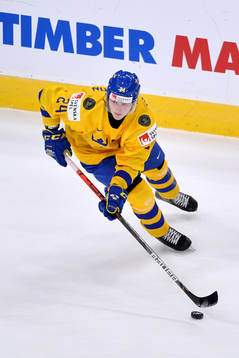Oskar Olausson skates with the puck
