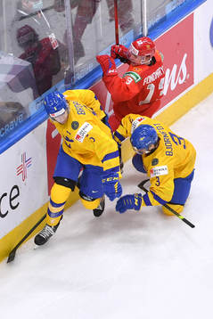 Tobias Björnfot and Philip Broberg of Sweden collide with