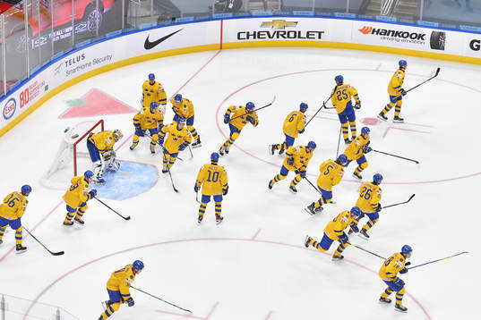 Team Sweden heads to the bench prior to the 2021 IIHF World