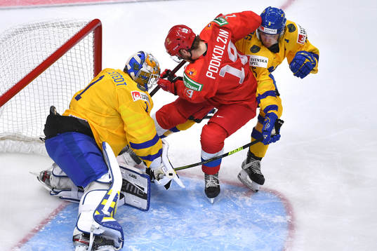 Vasili Podkolzin of Russia crashes the net