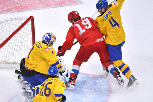 Vasili Podkolzin of Russia crashes the net