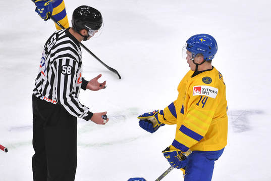 Arvid Costmar of Sweden argues with the linesman