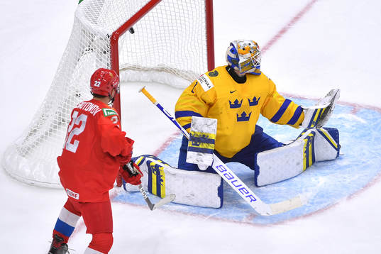 Jesper Wallstedt of Sweden is unable to make the save for