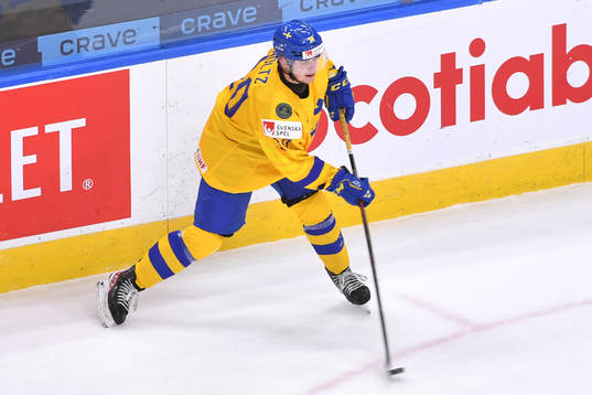 Alexander Holtz of Sweden shoots a puck that would be