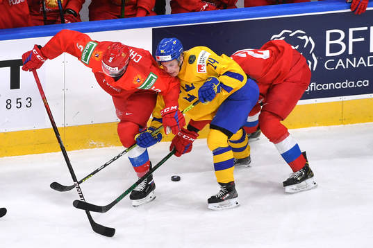 Arvid Costmar of Sweden battles with Danil Chaika of Russia