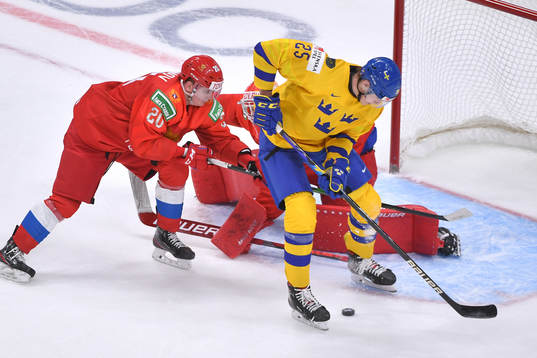 Elmer Söderblom of Sweden loses control of the puck in