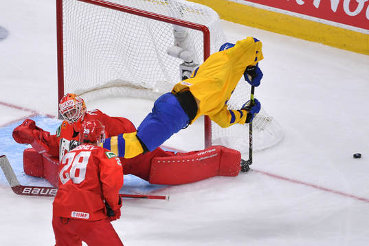 Philip Broberg of Sweden flies past the crease as Yaroslav
