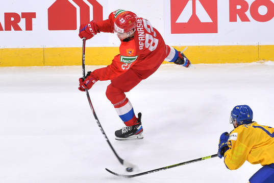Yegor Afanasiev of Russia shoots the puck