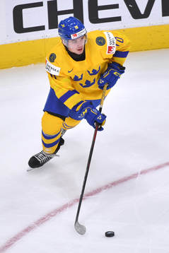 Alexander Holtz of Sweden skates with the puck
