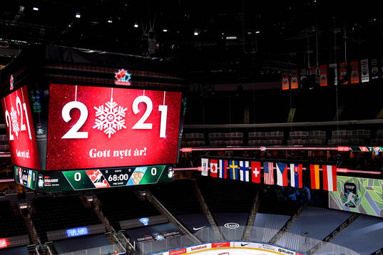 The score clock at Rogers Place displays New Year's wishes