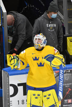 Hugo Alnefelt of Sweden sprays water in the air