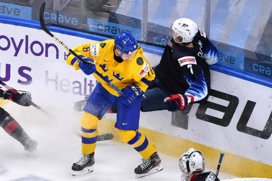 Lucas Raymond of Sweden and Tyler Kleven of USA collide