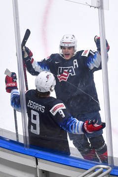 Trevor Zegras and Alex Turcotte of USA celebrate the 2-0