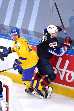 Trevor Zegras of USA and Alexander Holtz of Sweden collide