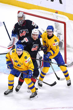 Oscar Bjerselius, and Oskar Kvist of Sweden battle in front
