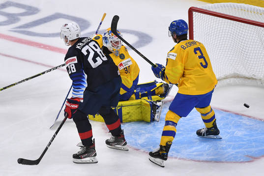 Hugo Alnefelt of Sweden watches the puck go in the net